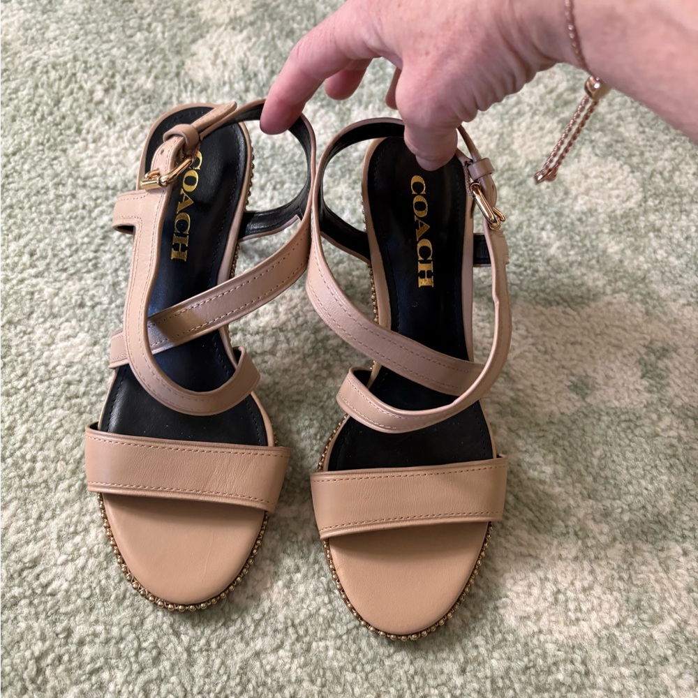 Coach size 7 B cream strap sandals.